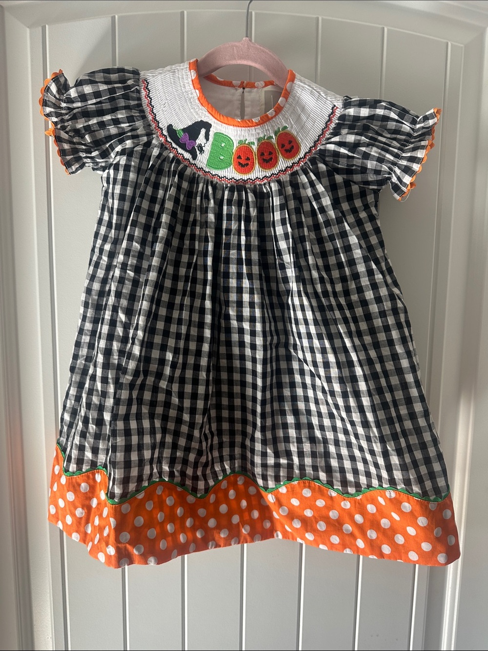 Lil Cactus Black and White checkered dress with smocked details and fun trim!